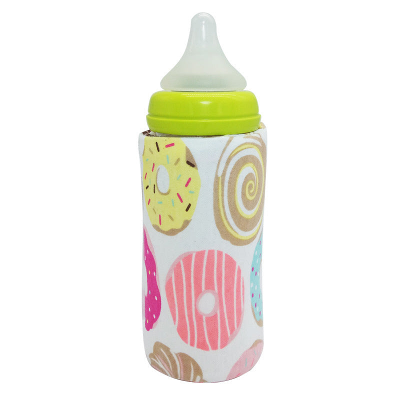 Shopi Vella portable baby bottle warmer with colorful donut design cover for on-the-go use