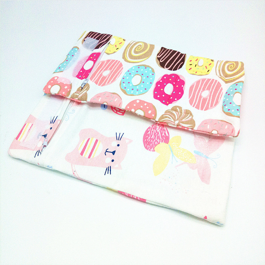 Shopi Vella portable baby bottle warmer with colorful donut and animal print fabric