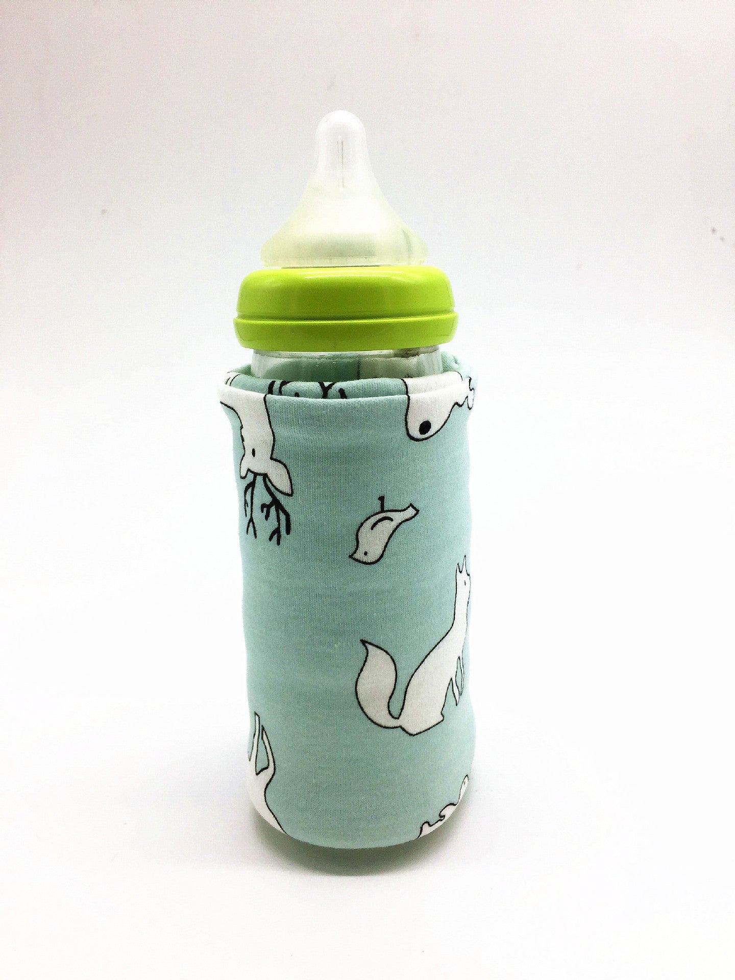 Shopi Vella portable baby bottle warmer with green cap and animal print cover for drinkware