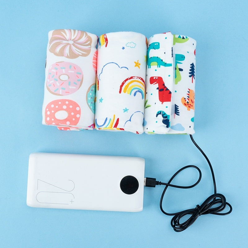 Shopi Vella portable baby bottle warmer with colorful patterned wraps including donuts rainbows and dinosaurs