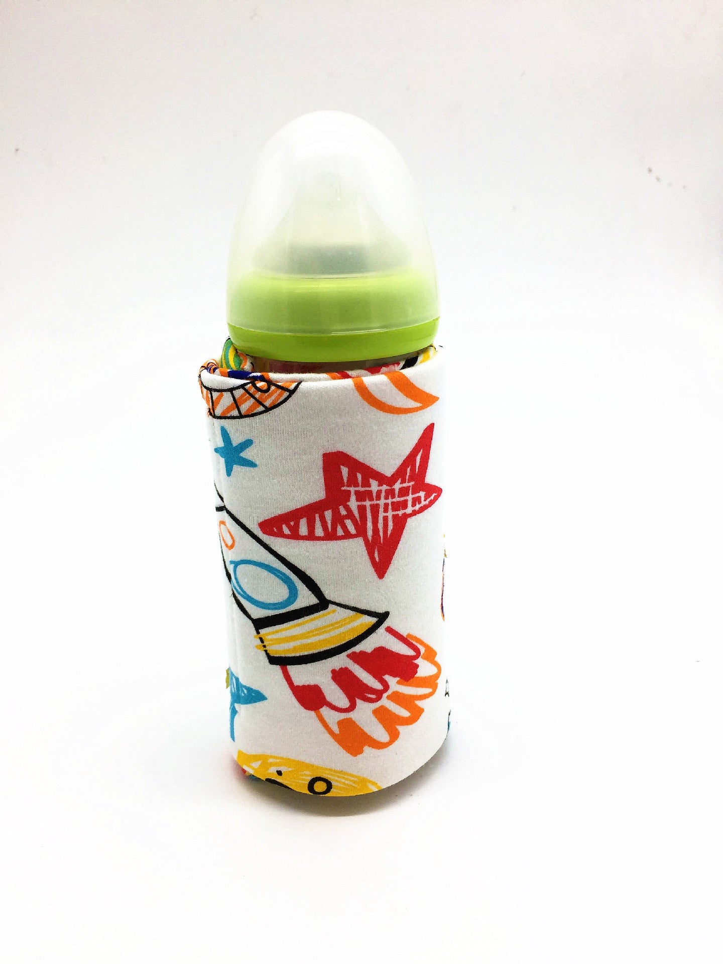 Shopi Vella portable baby bottle warmer with colorful star and rocket design on white background