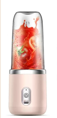 Shopi Vella portable blender for smoothies in pink with fresh tomatoes inside transparent jar
