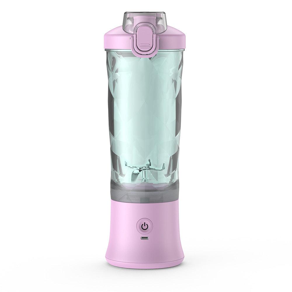 Pink portable blender for smoothies with clear blending jar and power button for easy use