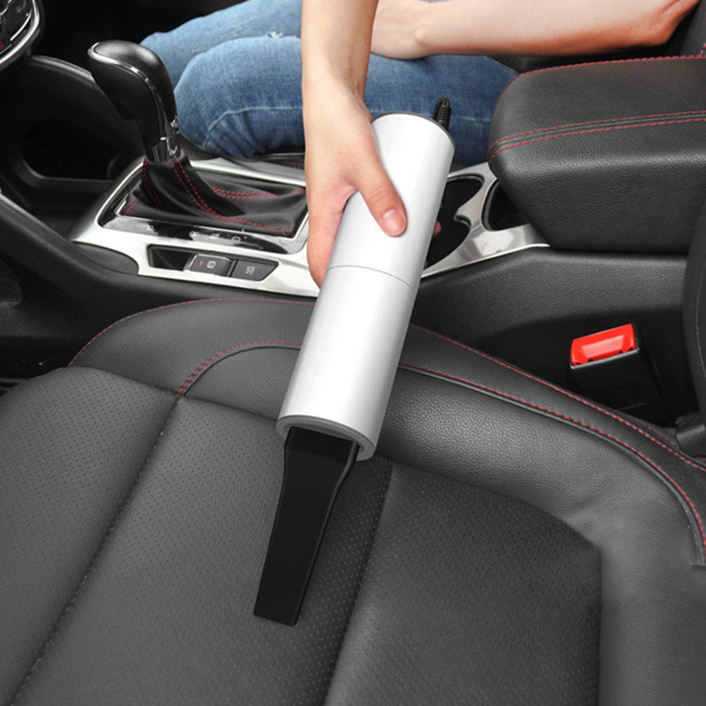 Shopi Vella portable car vacuum cleaner in white used to clean black leather car seat