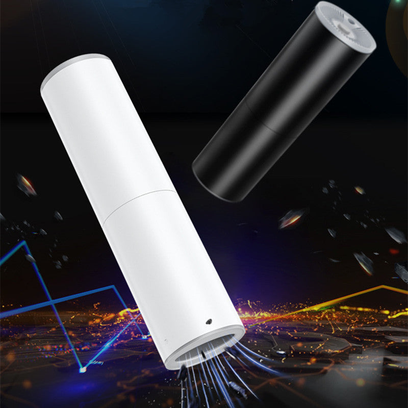 Shopi Vella portable car vacuum cleaner in sleek black and white with compact cylindrical design