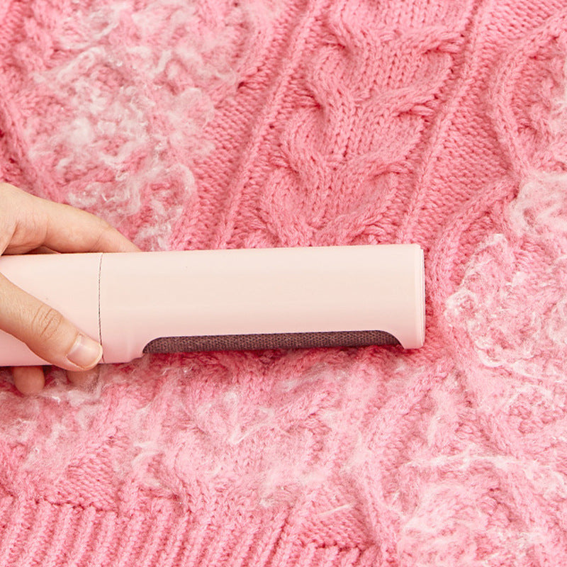 Shopi Vella portable cat dog fur removal tool cleaning pet hair from pink knitted sweater