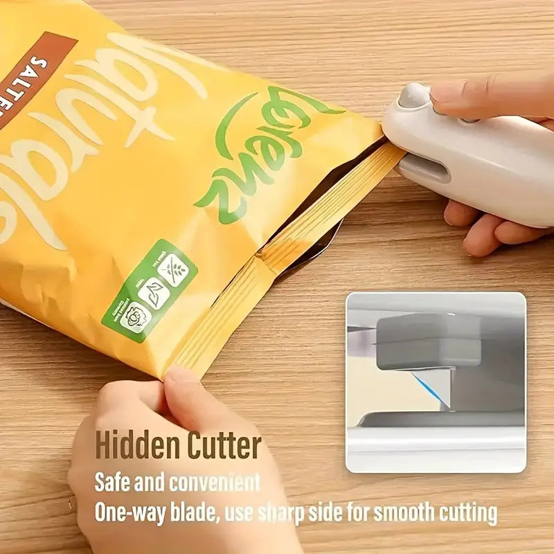 Shopi Vella portable chip bag resealer with cutter sealing a yellow chip bag on wooden surface