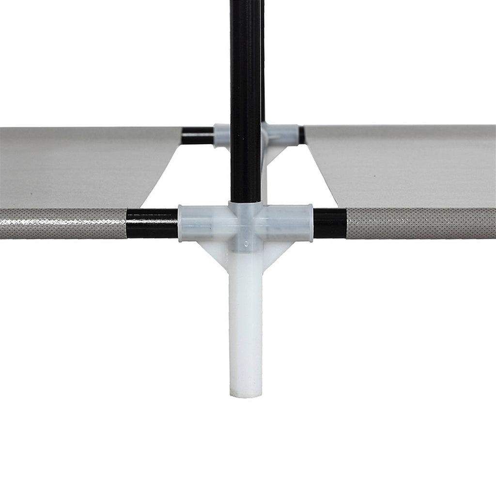 Close-up of black metal frame and white plastic joint of portable closet organizer with shelves by Shopi Vella