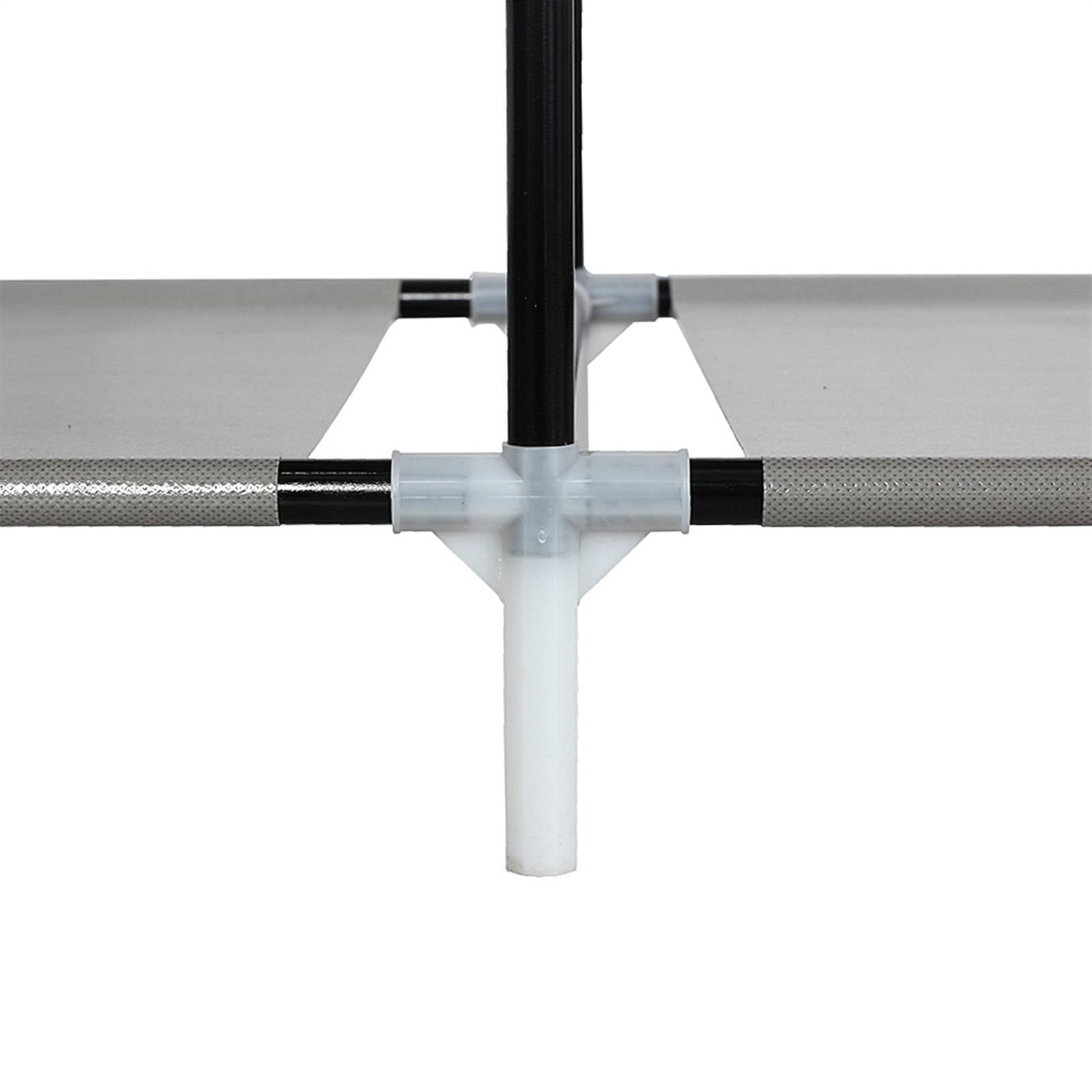 Close-up of black metal frame and white plastic joint of portable closet organizer with shelves by Shopi Vella