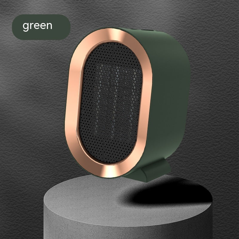 Shopi Vella green portable desktop electric heater with copper trim on gray pedestal