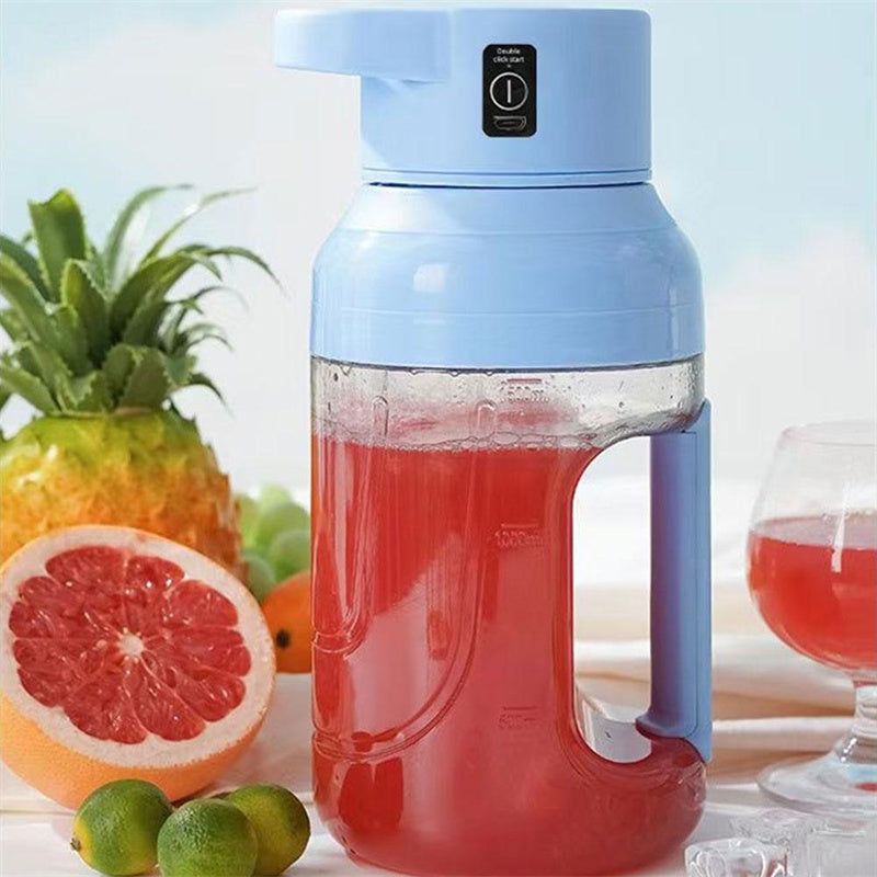 Shopi Vella portable electric juicer blender in blue filled with red juice next to fresh fruits