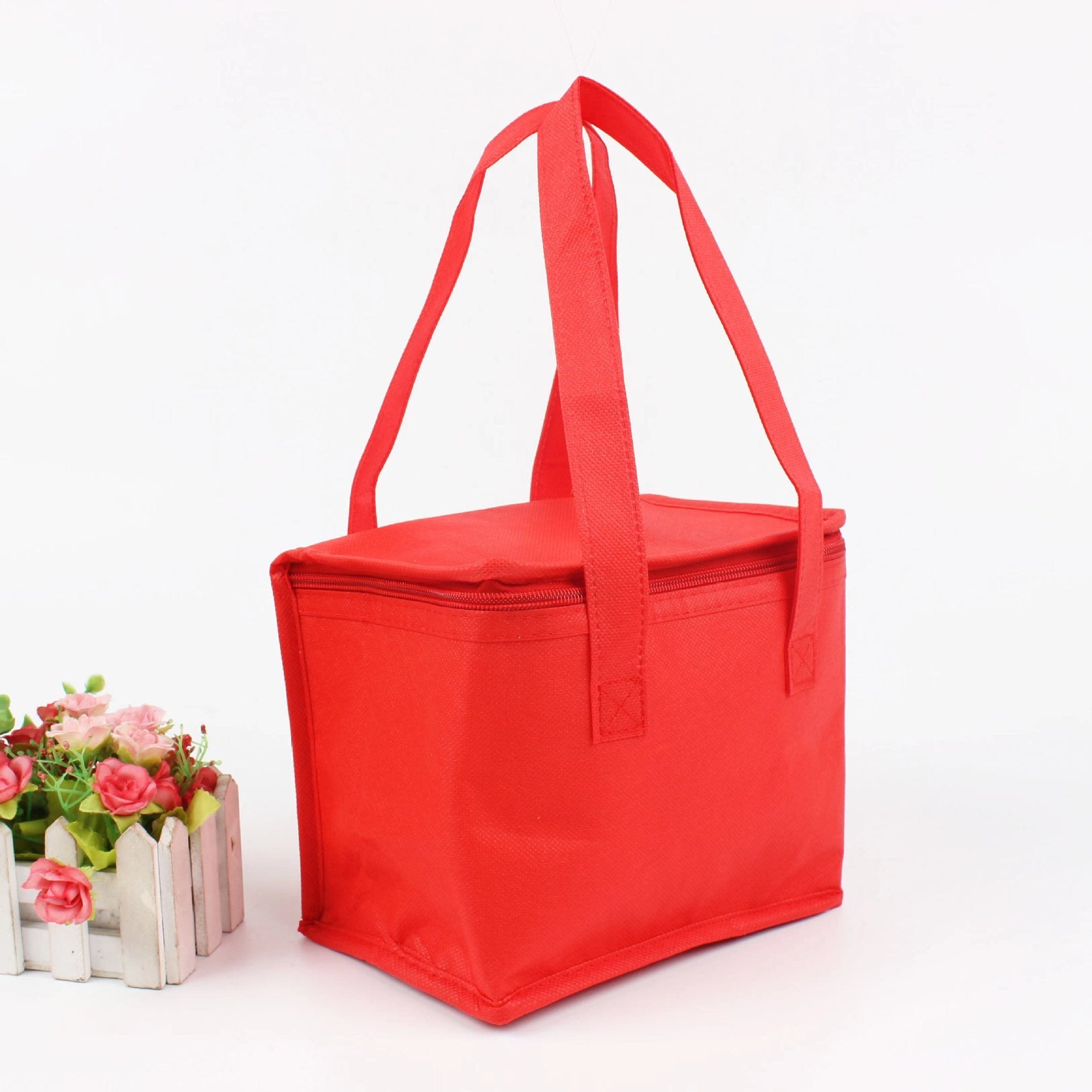 Red Shopi Vella portable insulated lunch bag with zipper and carrying handles for easy transport