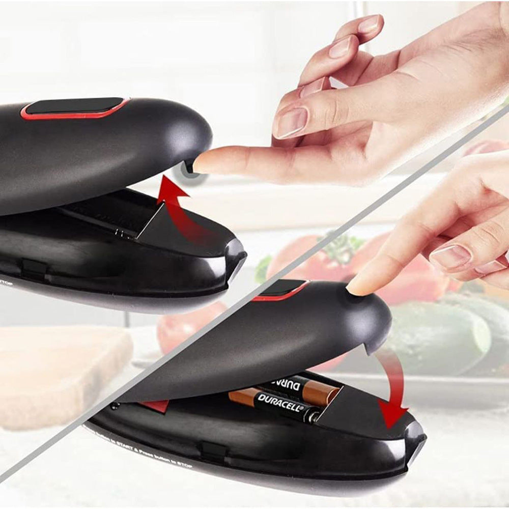 Black portable kitchen opener tool demonstrating finger opening and battery compartment access