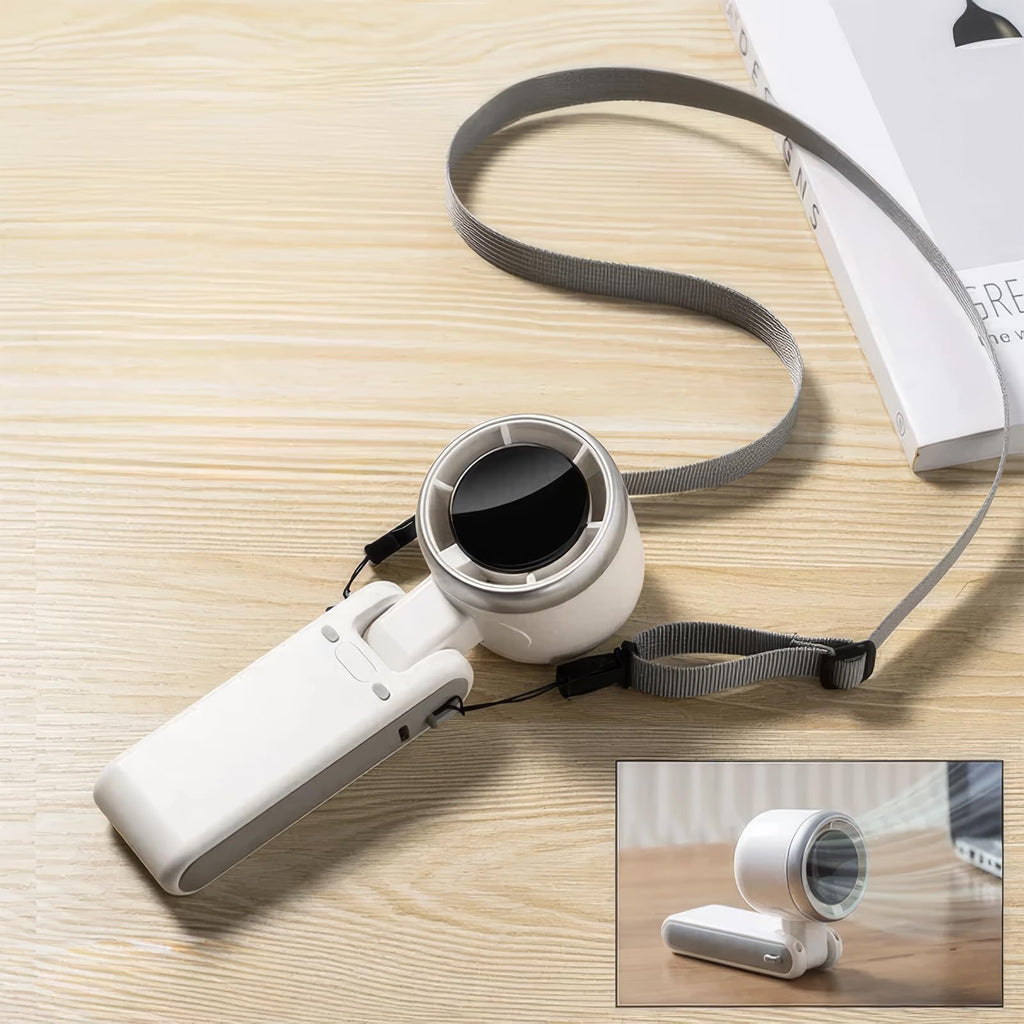 Shopi Vella portable mini fan rechargeable with foldable design and wrist strap on wooden surface