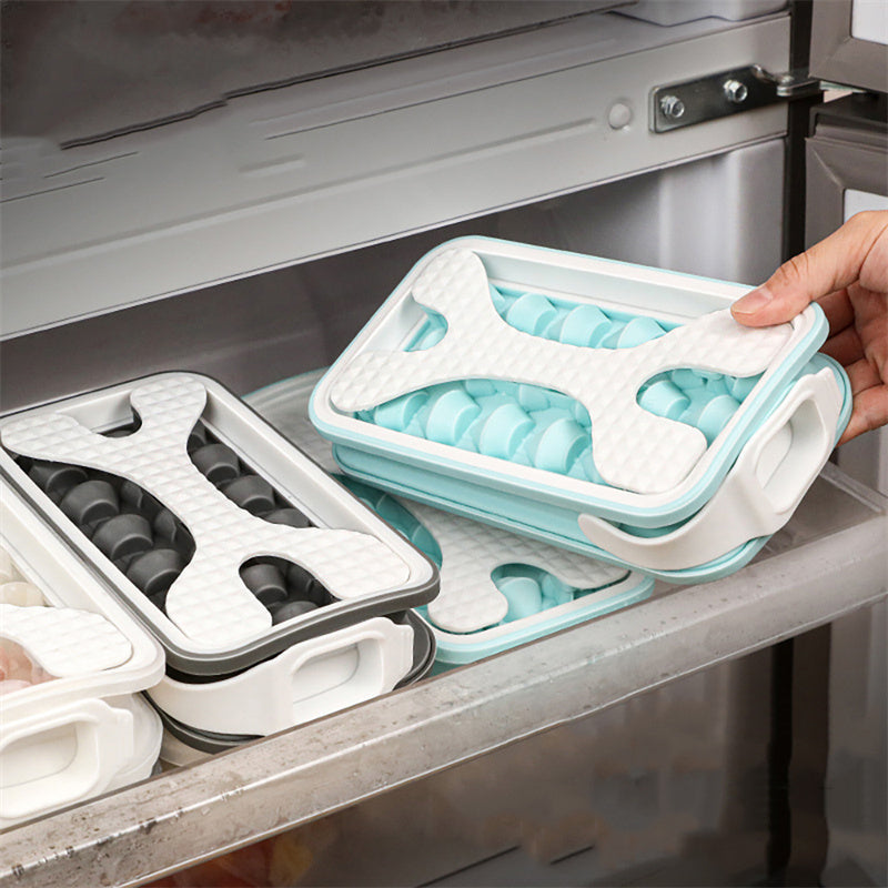 Shopi Vella portable silicone ice ball mold sets in blue and black stored inside a freezer drawer