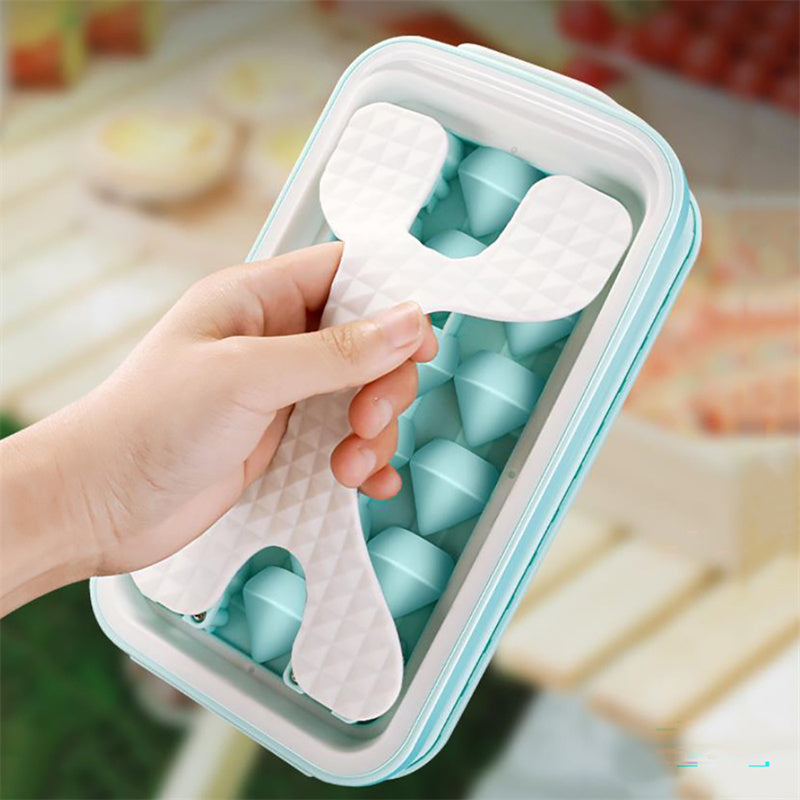 Shopi Vella portable silicone ice ball mold in light blue with white handle for easy ice removal