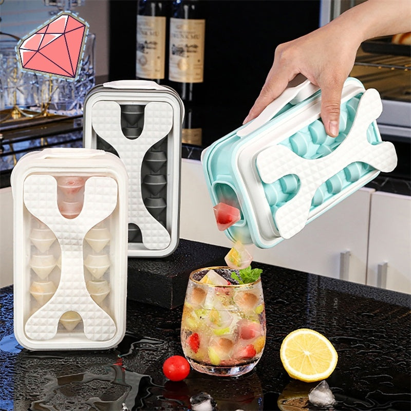 Shopi Vella portable silicone ice ball mold set with easy-fill design pouring ice balls into a glass