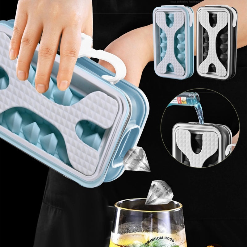 Shopi Vella portable silicone ice ball mold with diamond-shaped ice cubes pouring into a glass
