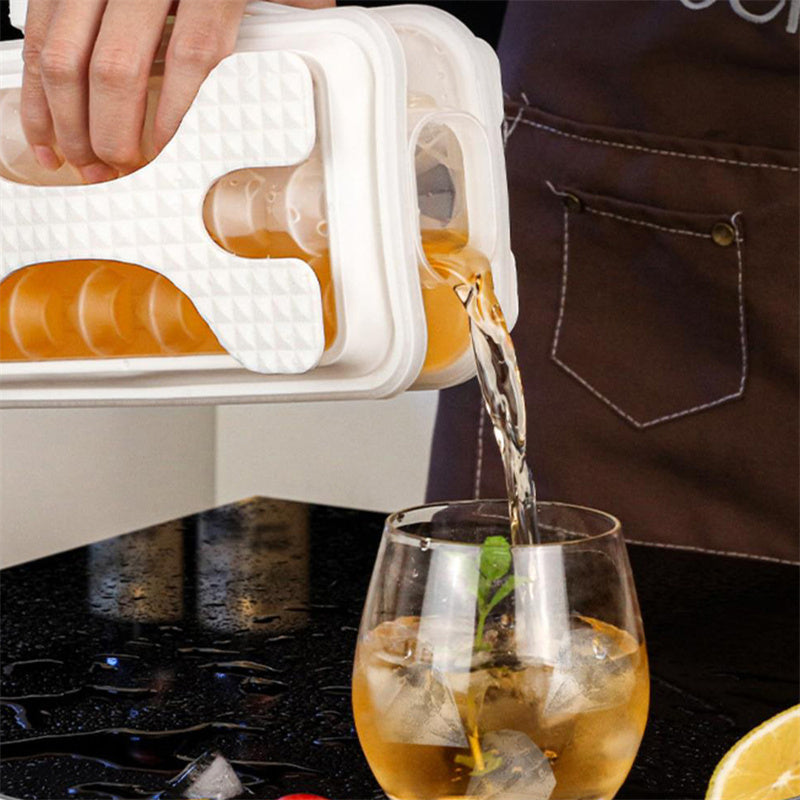Shopi Vella portable silicone ice ball mold pouring ice balls into a glass on kitchen counter