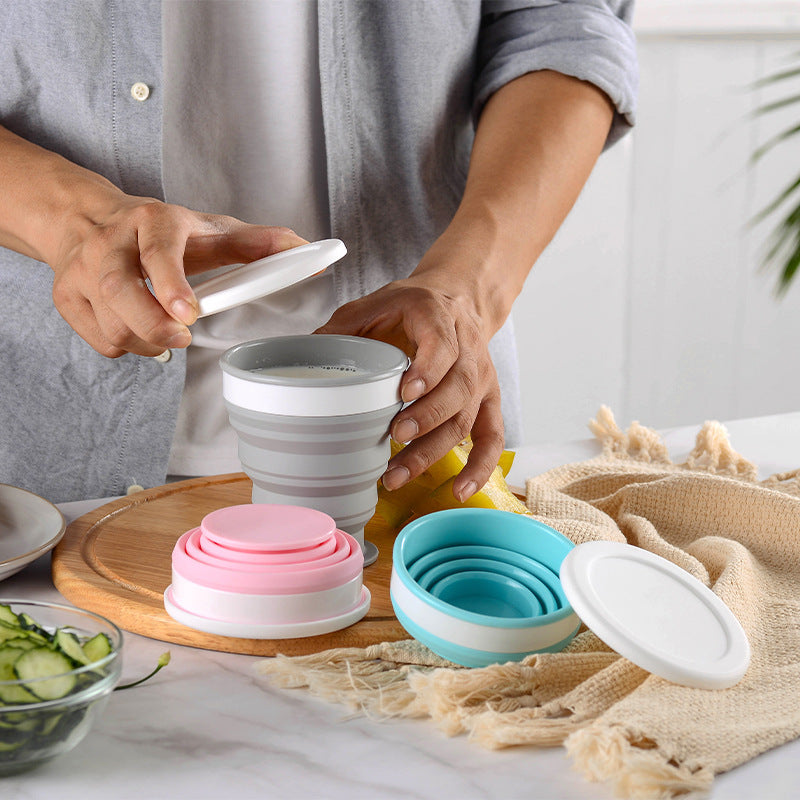 Shopi Vella portable silicone lunch box in gray, pink, and blue collapsible designs on kitchen counter