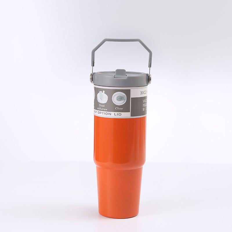 Shopi Vella orange portable stainless steel travel mug with gray lid and handle for easy carrying