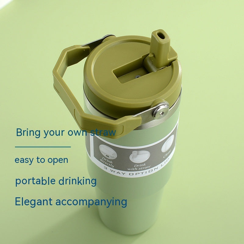 Shopi Vella portable stainless steel travel mug in green with handle and flip-up straw lid