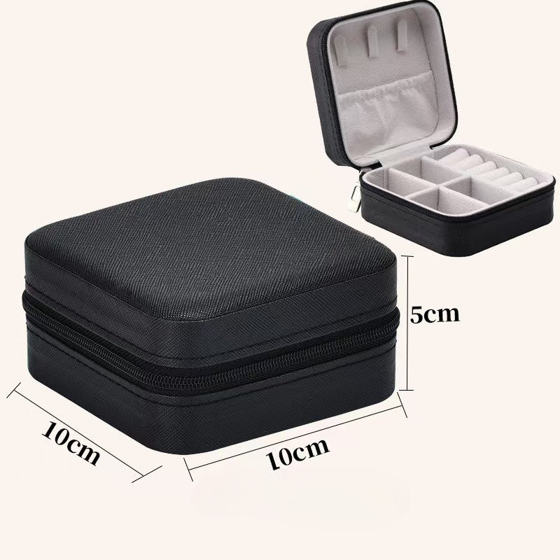 Shopi Vella portable travel jewelry box in black with compact storage compartments and zipper closure