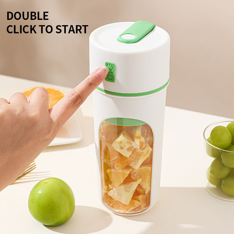 Shopi Vella wireless portable juicer cup with green accents being activated by a finger press