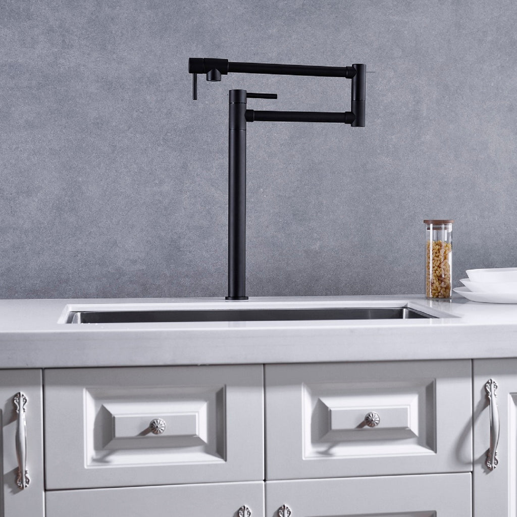 Shopi Vella black pot filler faucet with extended handle installed above kitchen sink with gray backsplash