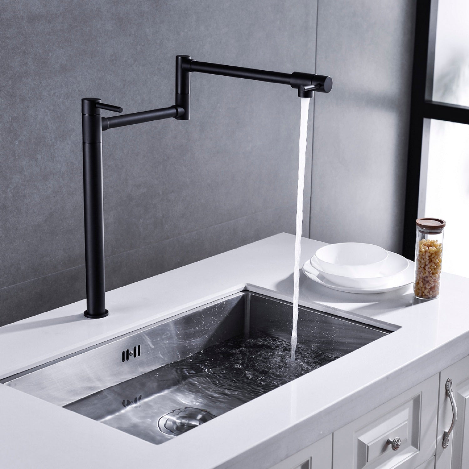 Shopi Vella black pot filler faucet with extended handle installed over a modern kitchen sink