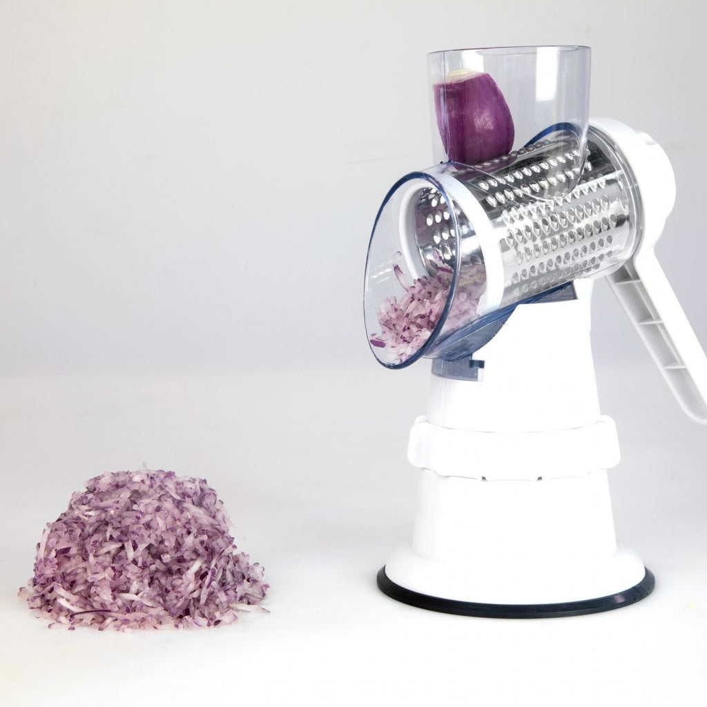 Shopi Vella potato and vegetable round shredder grating purple onion with shredded pieces falling out