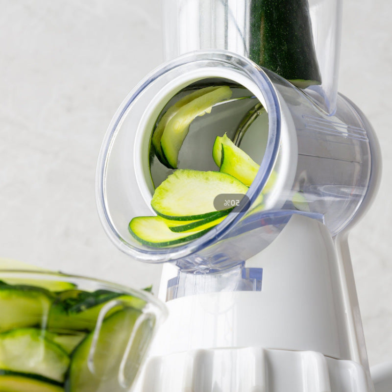 Shopi Vella potato and vegetable round shredder slicing fresh zucchini into thin pieces