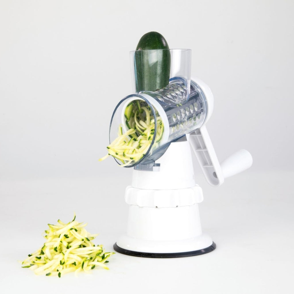 Shopi Vella potato and vegetable round shredder with handle shredding zucchini on white background