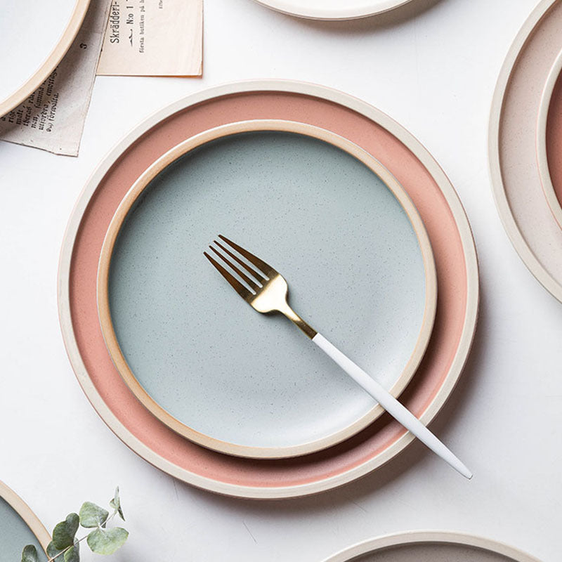 Shopi Vella pure color ceramic plate set with pastel pink and blue plates and a white-handled fork