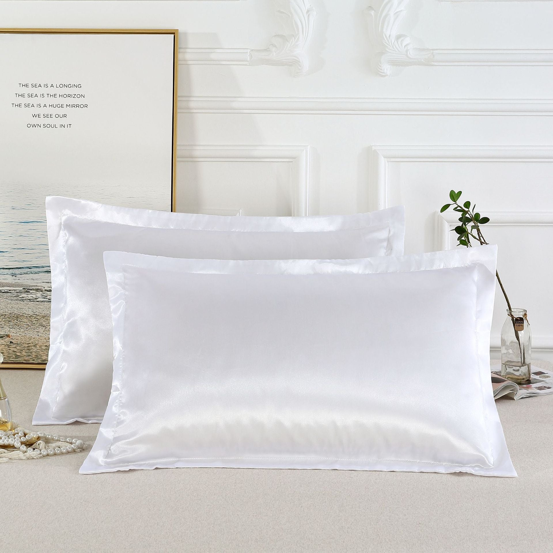Shopi Vella pure silk pillow case set in white with a smooth and shiny finish on a bed