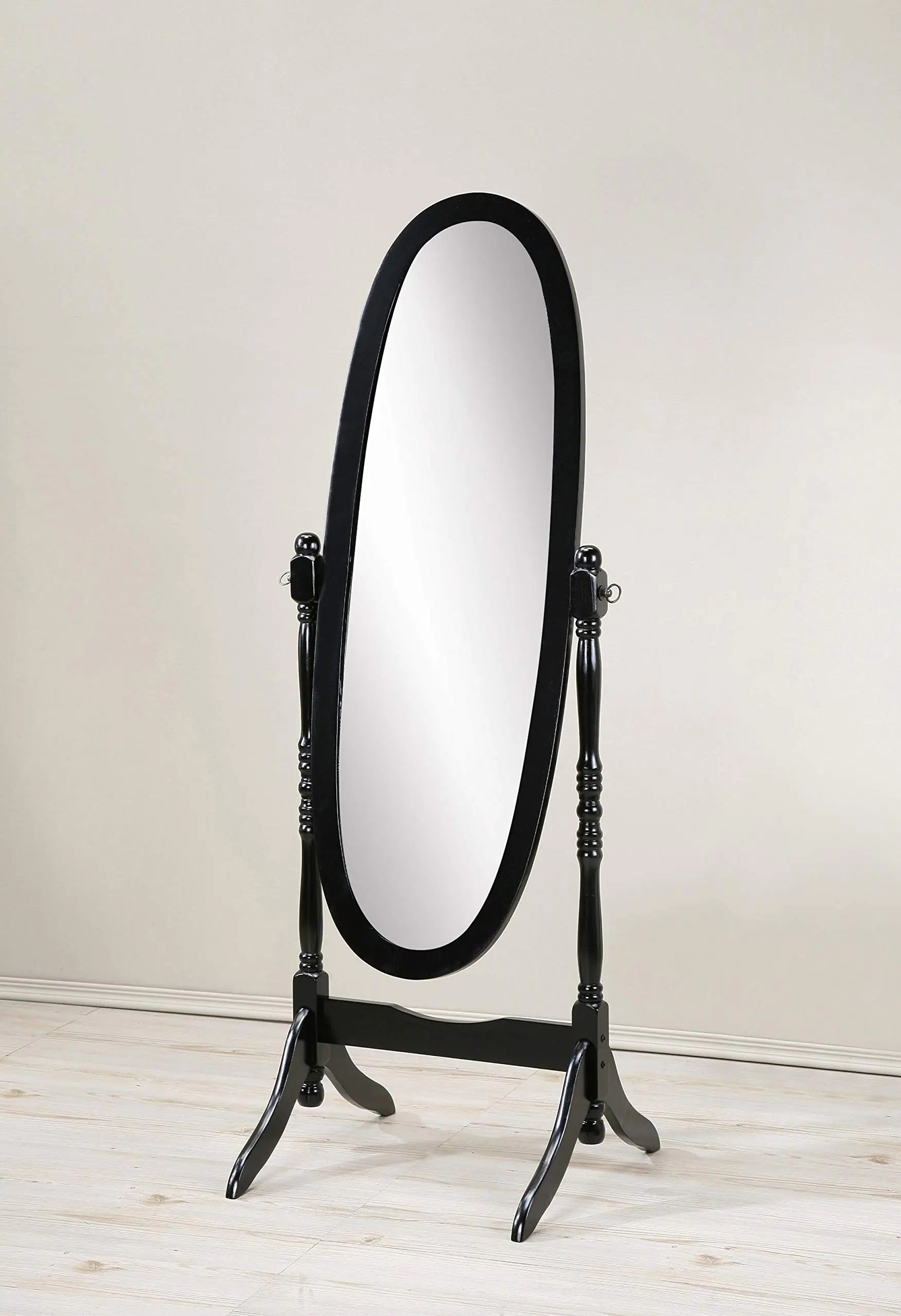 Elegant Queen Anne style floor mirror with black wooden frame and oval shape standing on a wooden floor