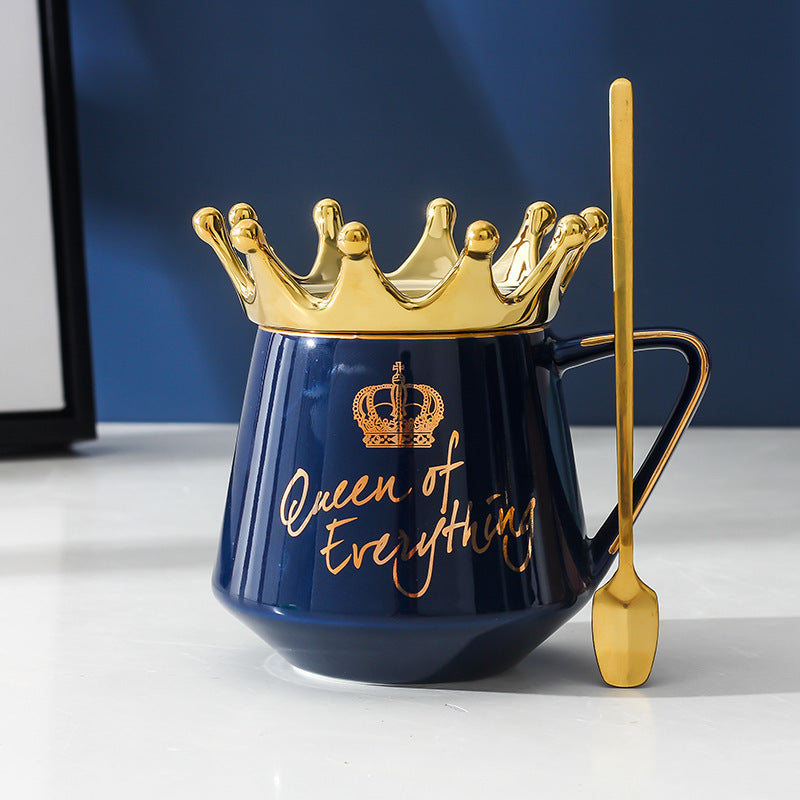 Shopi Vella queen mug with gold crown and matching gold spoon in blue with queen of everything text