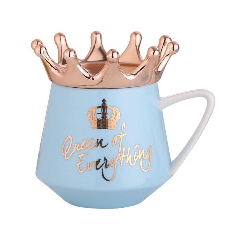 Queen mug with gold crown and blue body featuring gold text reading queen of everything
