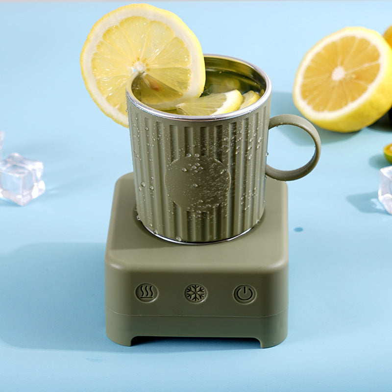 Shopi Vella quick beverage ice maker machine with a green cup and lemon slices on a blue surface
