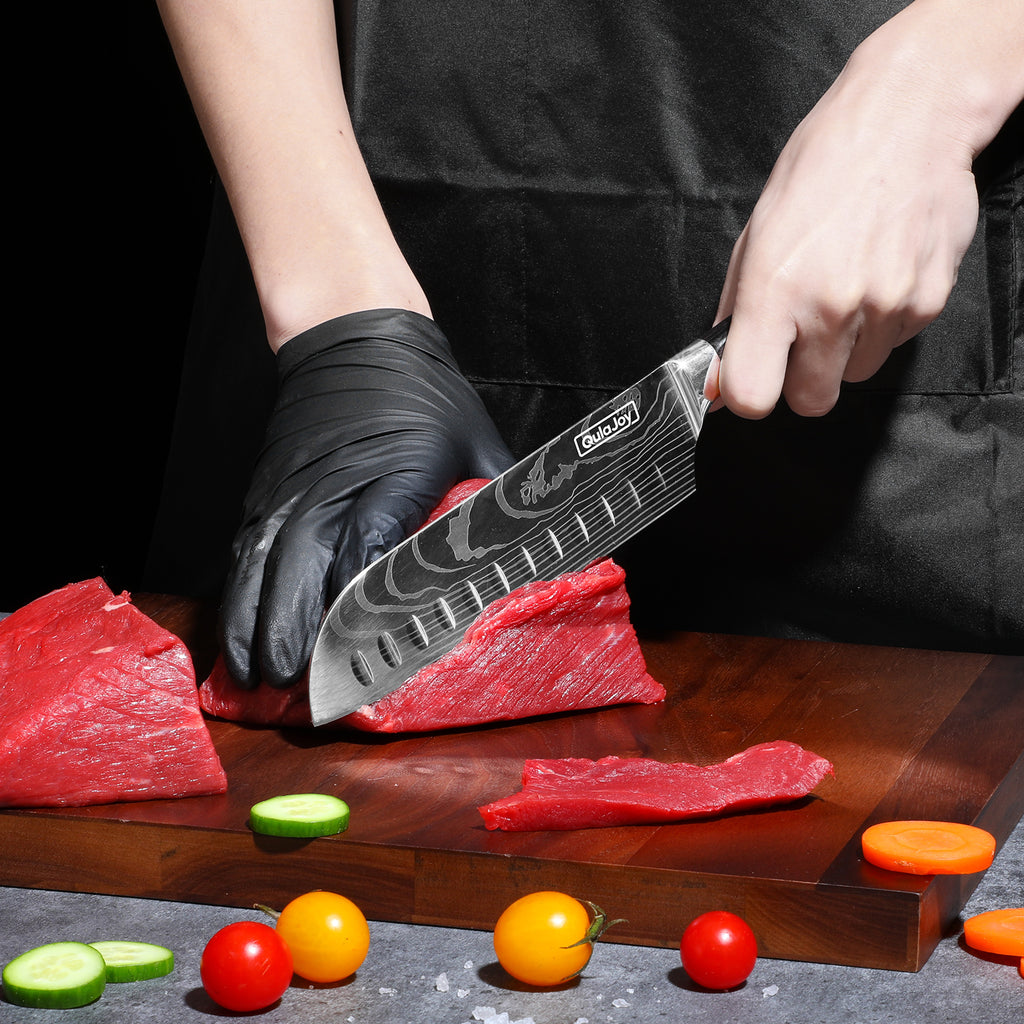 Japanese chef knife for home cooking cutting fresh beef on wooden board with vegetables nearby