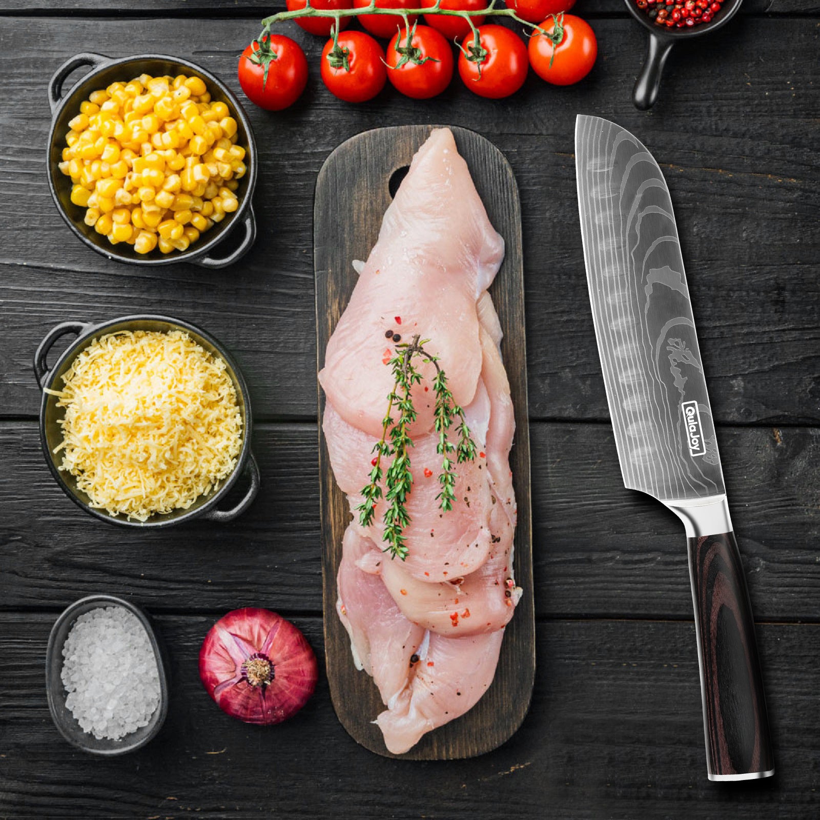 Japanese chef knife for home cooking with sharp blade beside fresh raw chicken and ingredients on dark wooden table