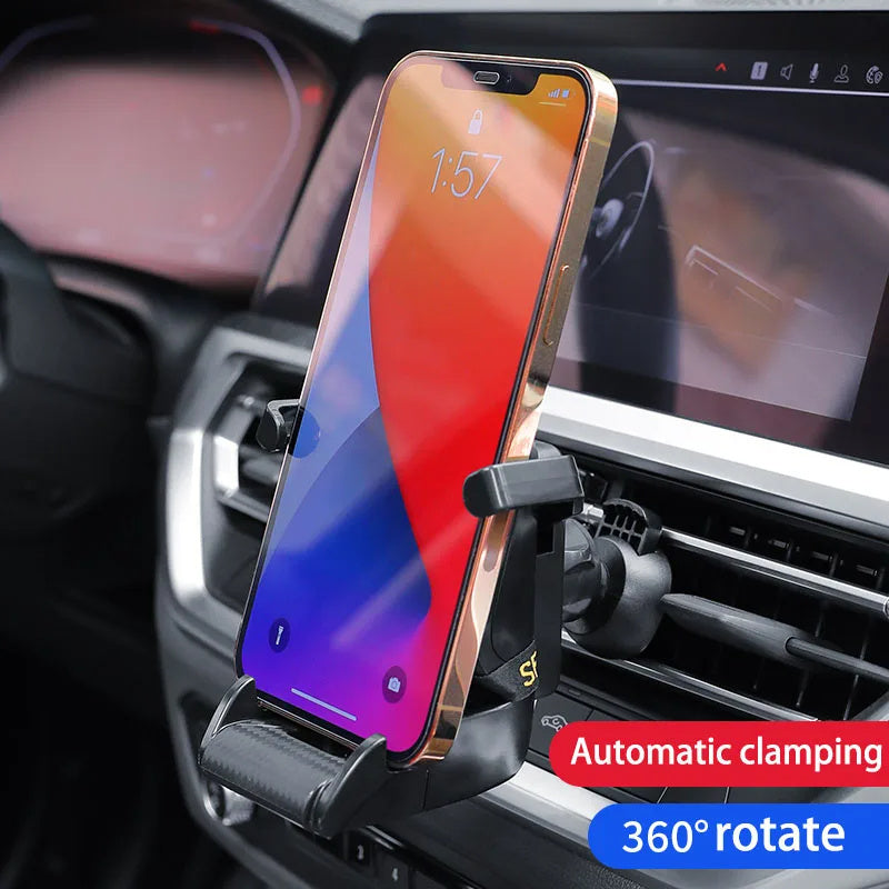 Shopi Vella racing seat car phone holder mounted on car air vent holding a smartphone with automatic clamping and 360 degree rotation