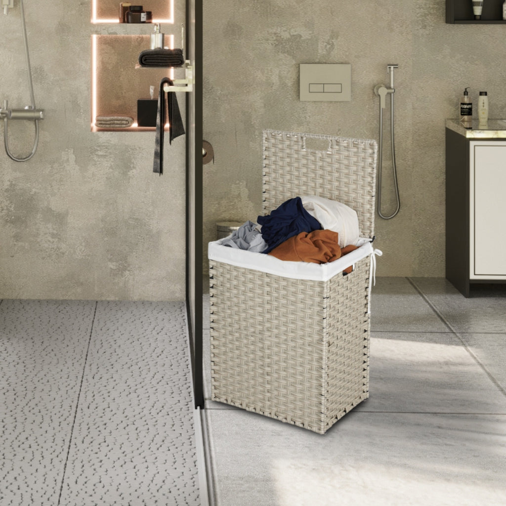 Shopi Vella rattan laundry hamper with lid filled with clothes in modern bathroom setting
