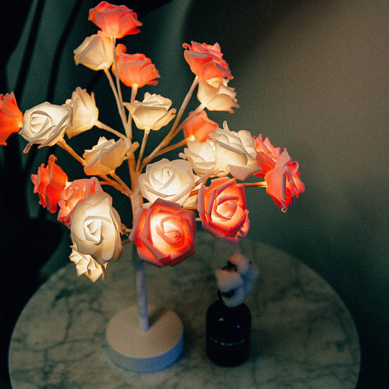 Shopi Vella rose flower LED night lamp with glowing white and orange roses on marble table