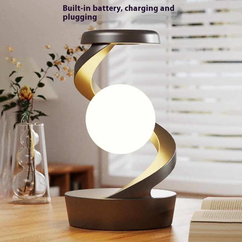 Shopi Vella rotating moon desk lamp with wireless charging featuring modern spiral design on wooden desk
