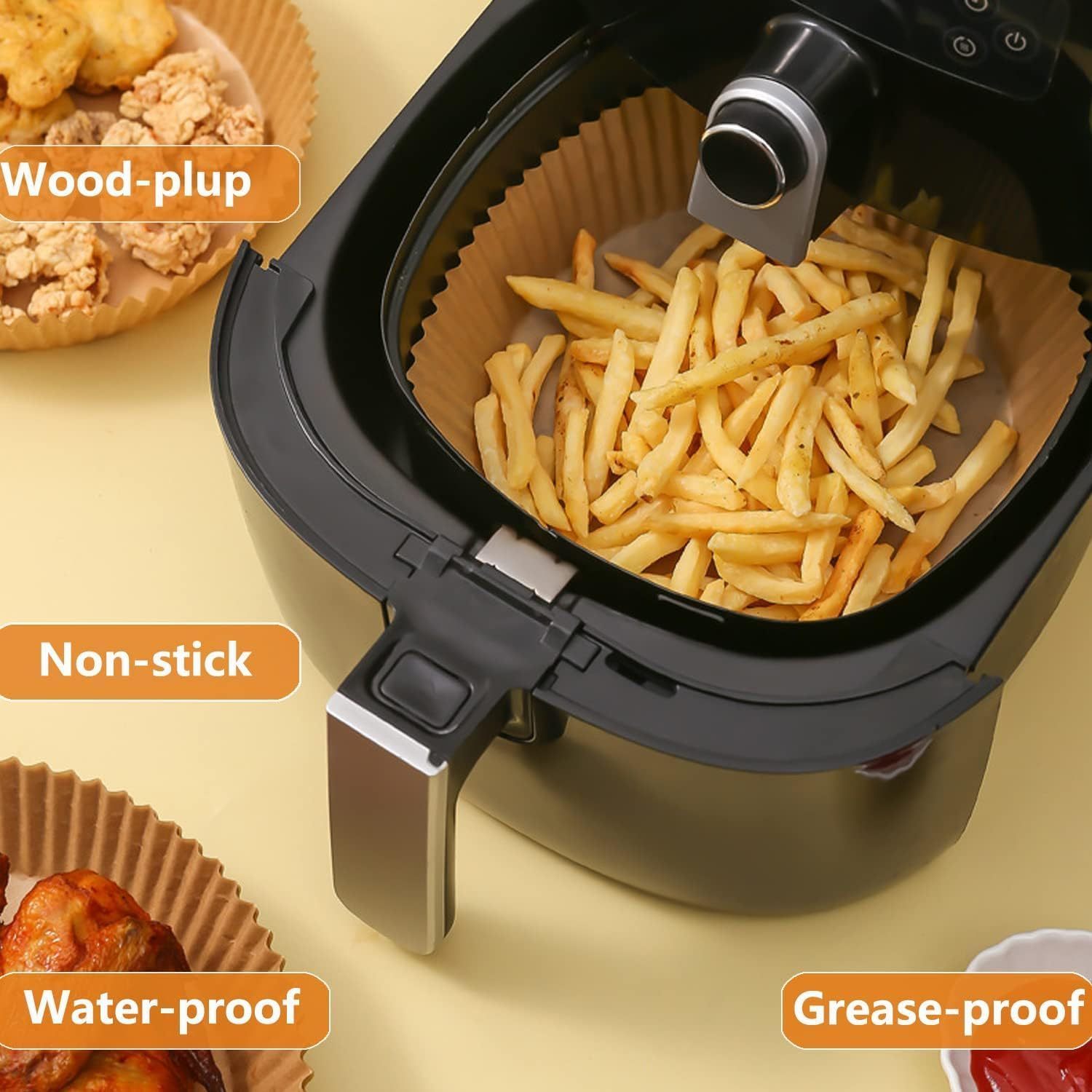 Round oil absorbing baking paper liners in air fryer with fries and chicken, non-stick and grease-proof