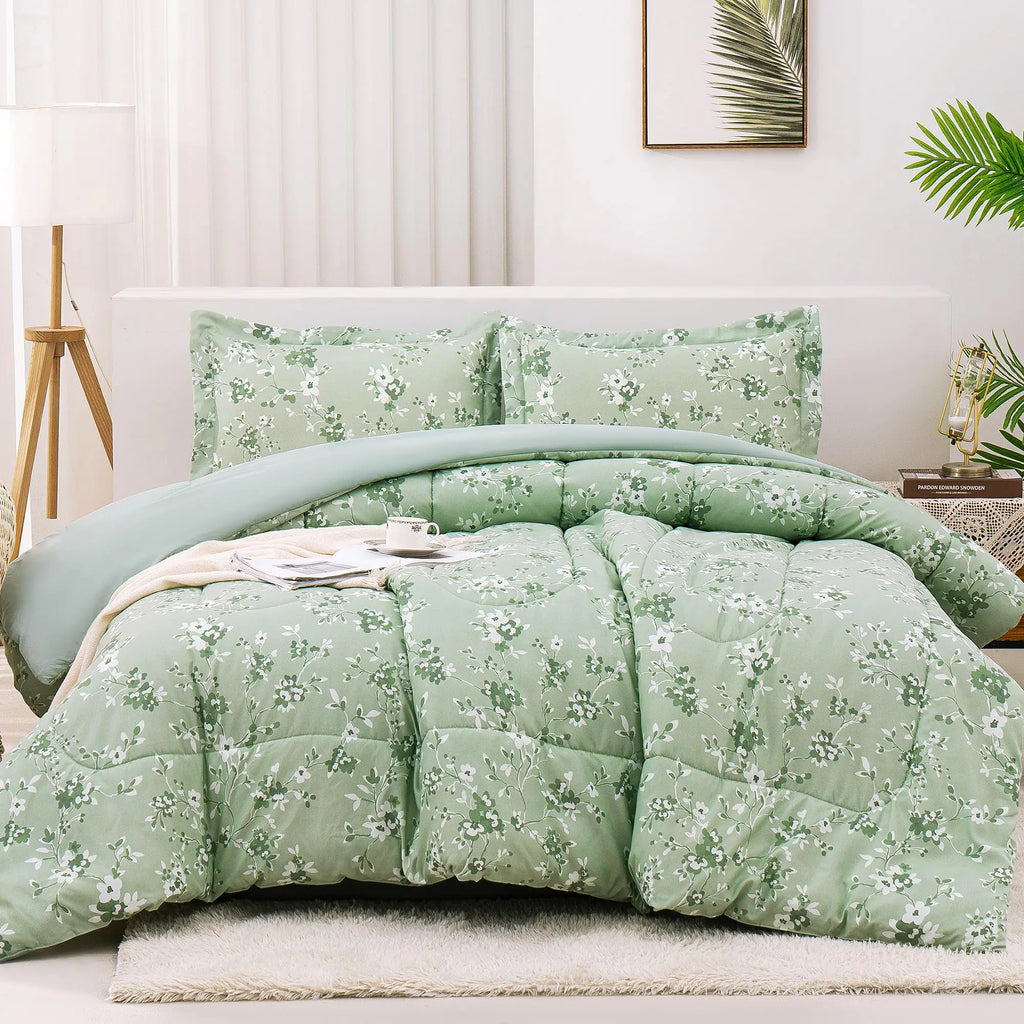 Sage green floral comforter set with matching pillow shams displayed on a bed in a modern bedroom