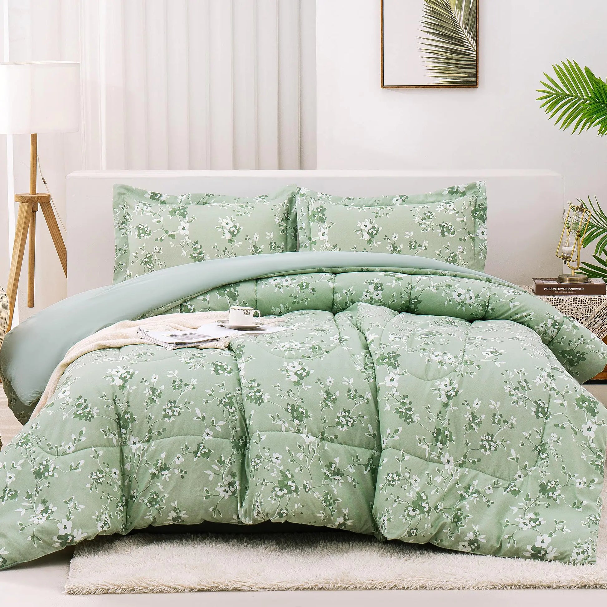 Sage green floral comforter set with matching pillow shams on a white bed in a modern bedroom