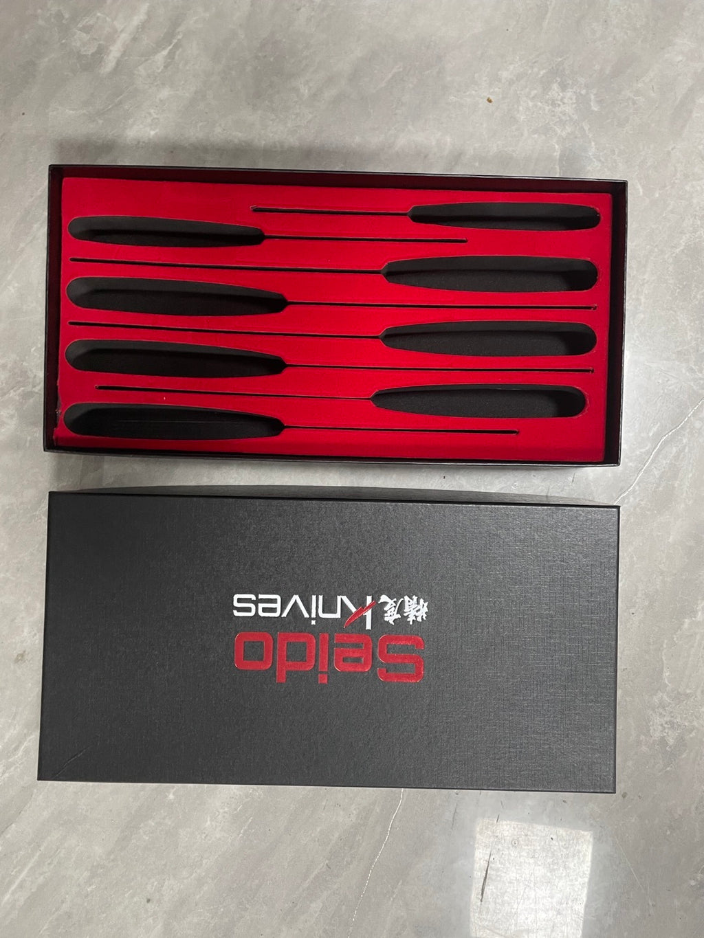 Shopi Vella Japanese style santoku knife set with six kitchen knives in sleek black handles and red presentation box