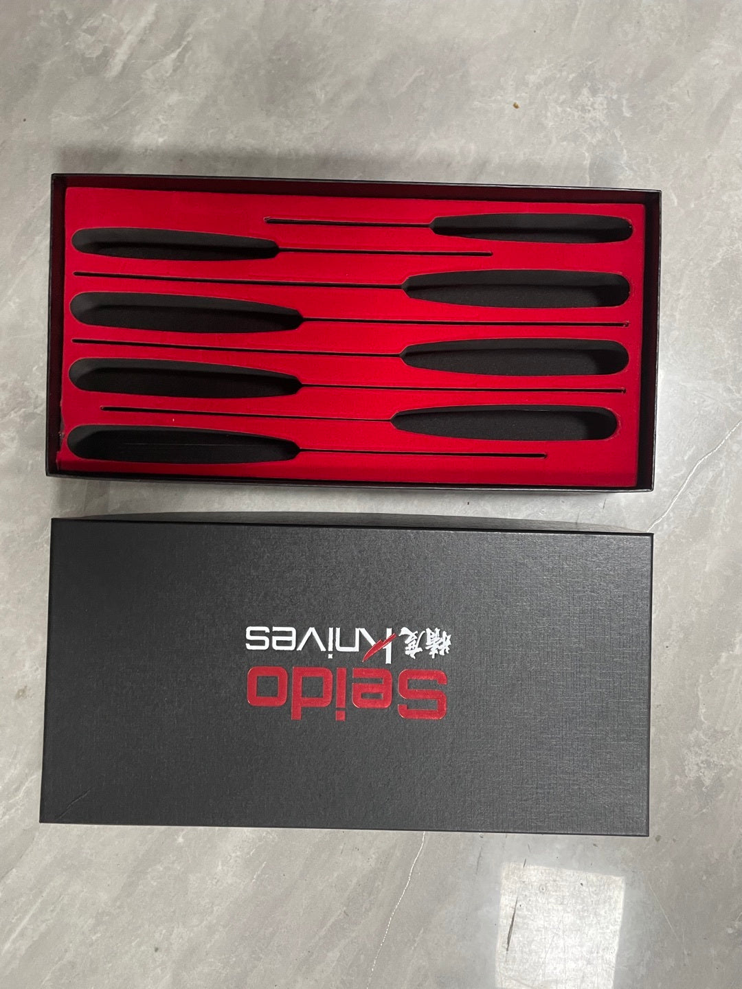 Shopi Vella Japanese style santoku knife set with six kitchen knives in sleek black handles and red presentation box